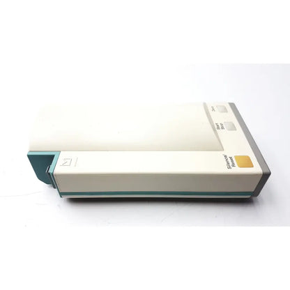 Cream-colored hewlett packard speed point technology m3000a device with teal and gray buttons including start stop and silence reset