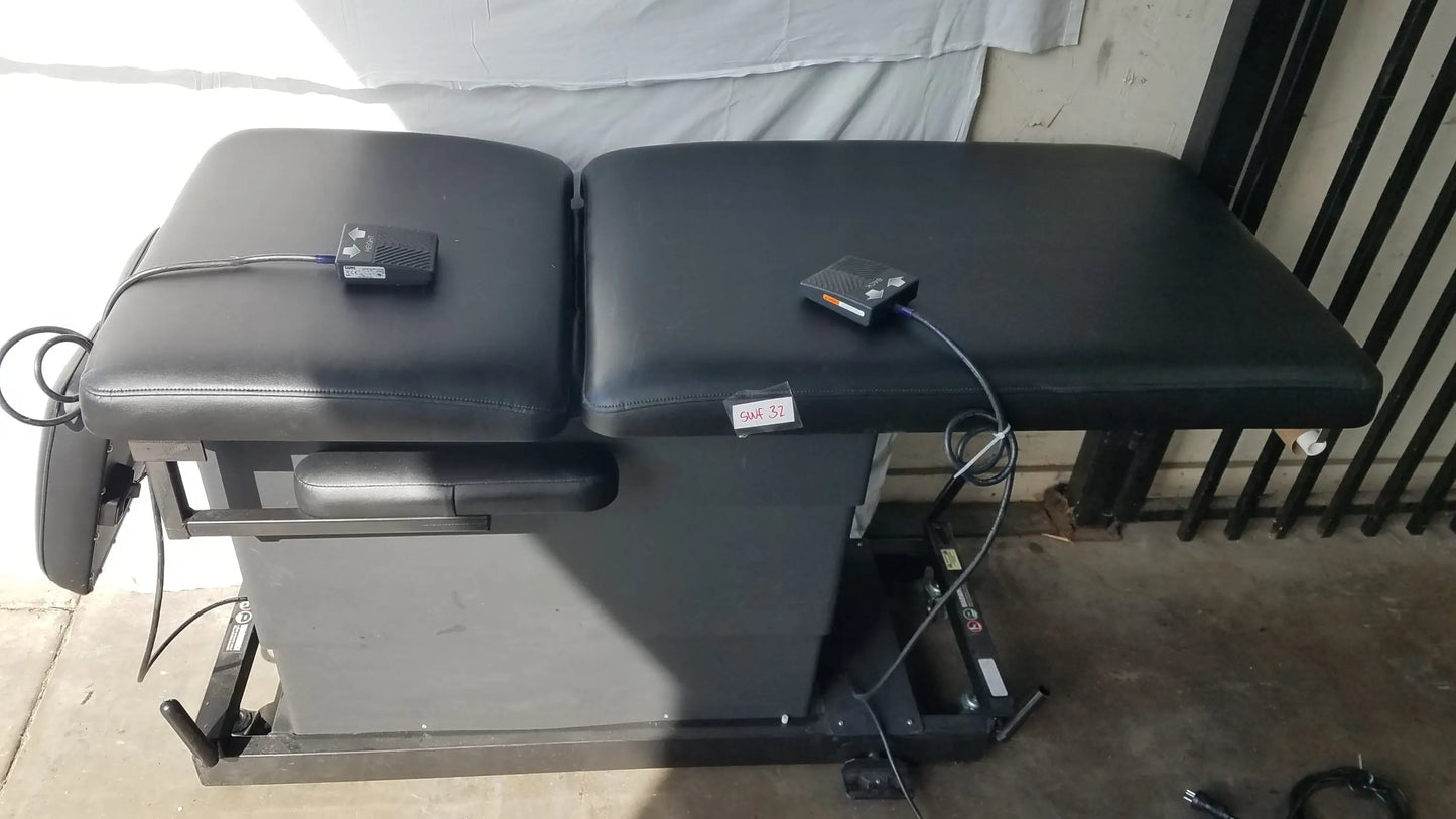 Black leather adjustable hill ha90pt mobilization physical therapy treatment table with two padded sections and controls