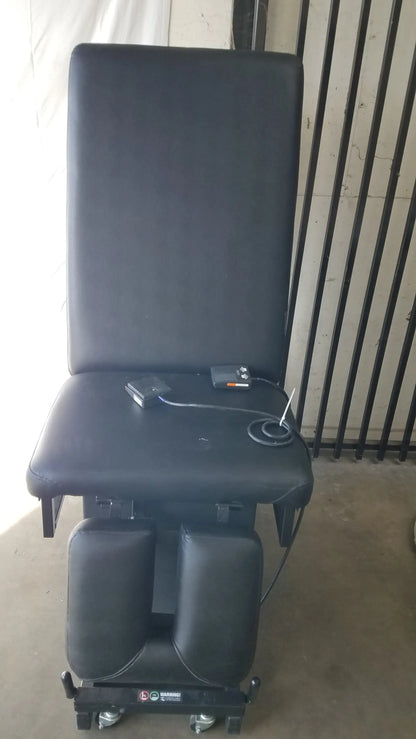 Black padded hill ha90pt mobilization physical therapy treatment table with adjustable footrest and control panel on seat