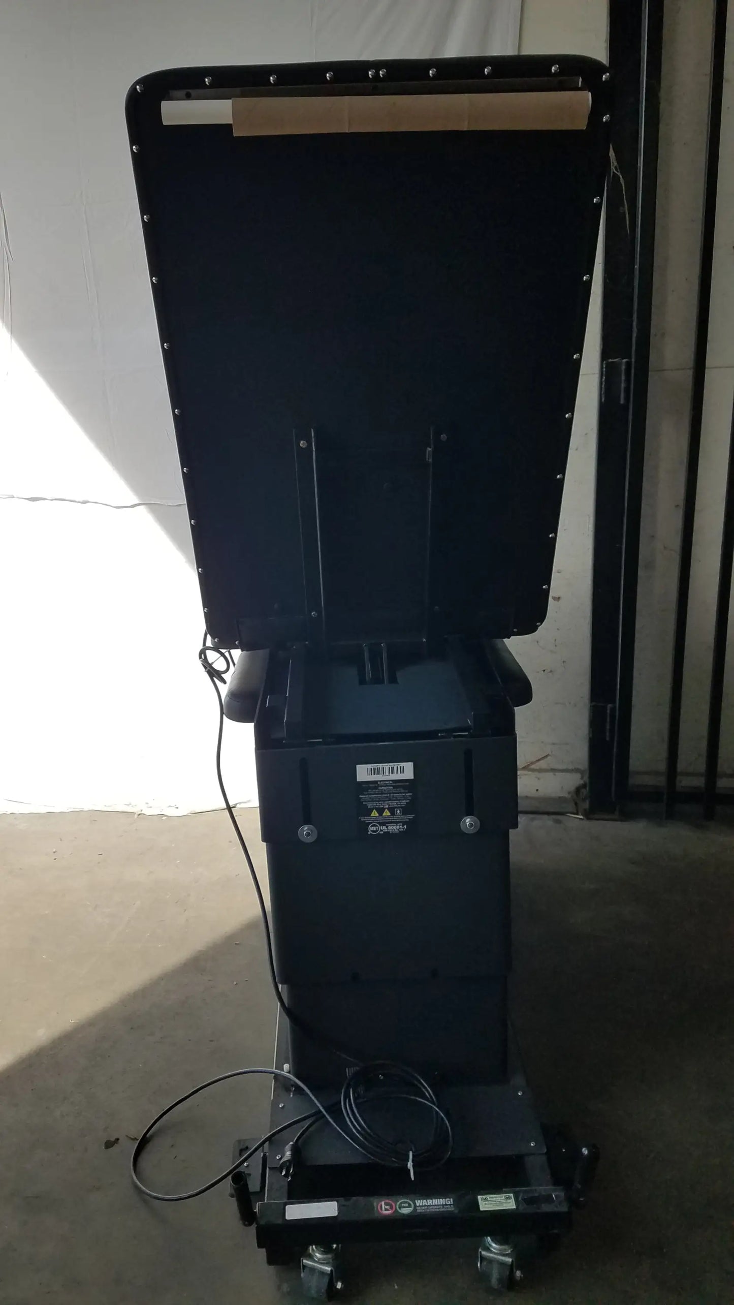 Black industrial-grade digital display stand with casters for mobility on hill ha90pt physical therapy treatment table