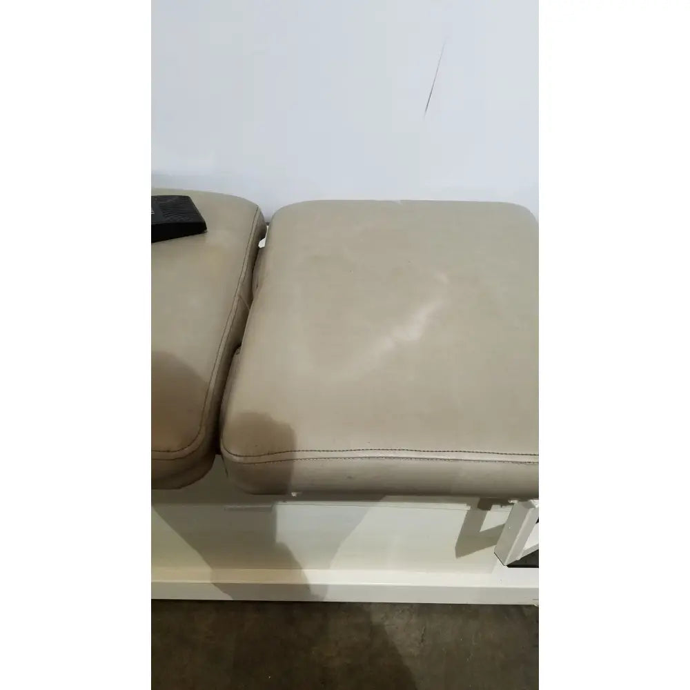 Beige leather ottoman with stitched edges and metal legs for hill model ha90pt physical therapy treatment table