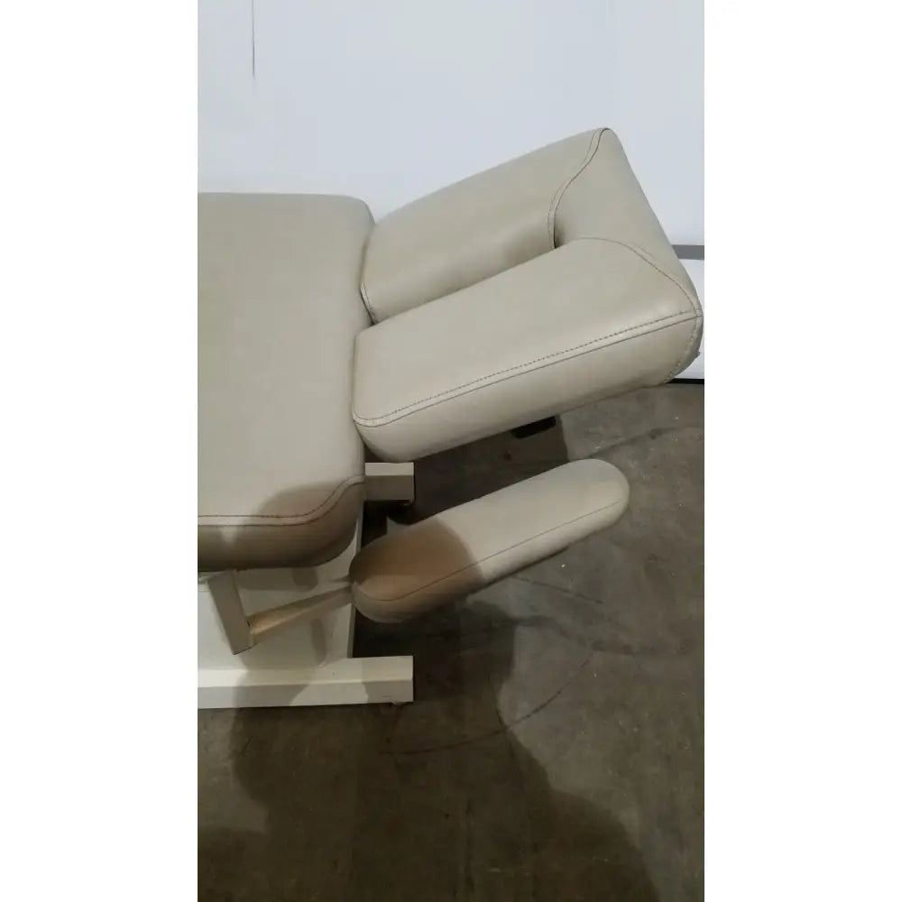 Beige leather massage table with padded headrest and footrest hill model ha90pt physical therapy treatment table