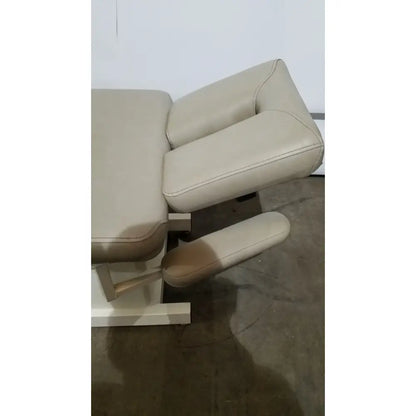 Beige leather massage table with padded headrest and footrest hill model ha90pt physical therapy treatment table
