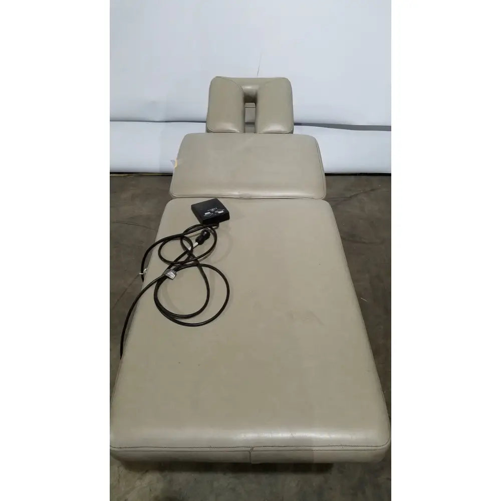 Beige leather hill model ha90pt physical therapy treatment table with padded surface and adjustable headrest