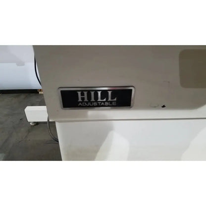 White hill model ha90pt physical therapy treatment table with black hill adjustable label plate on the back side