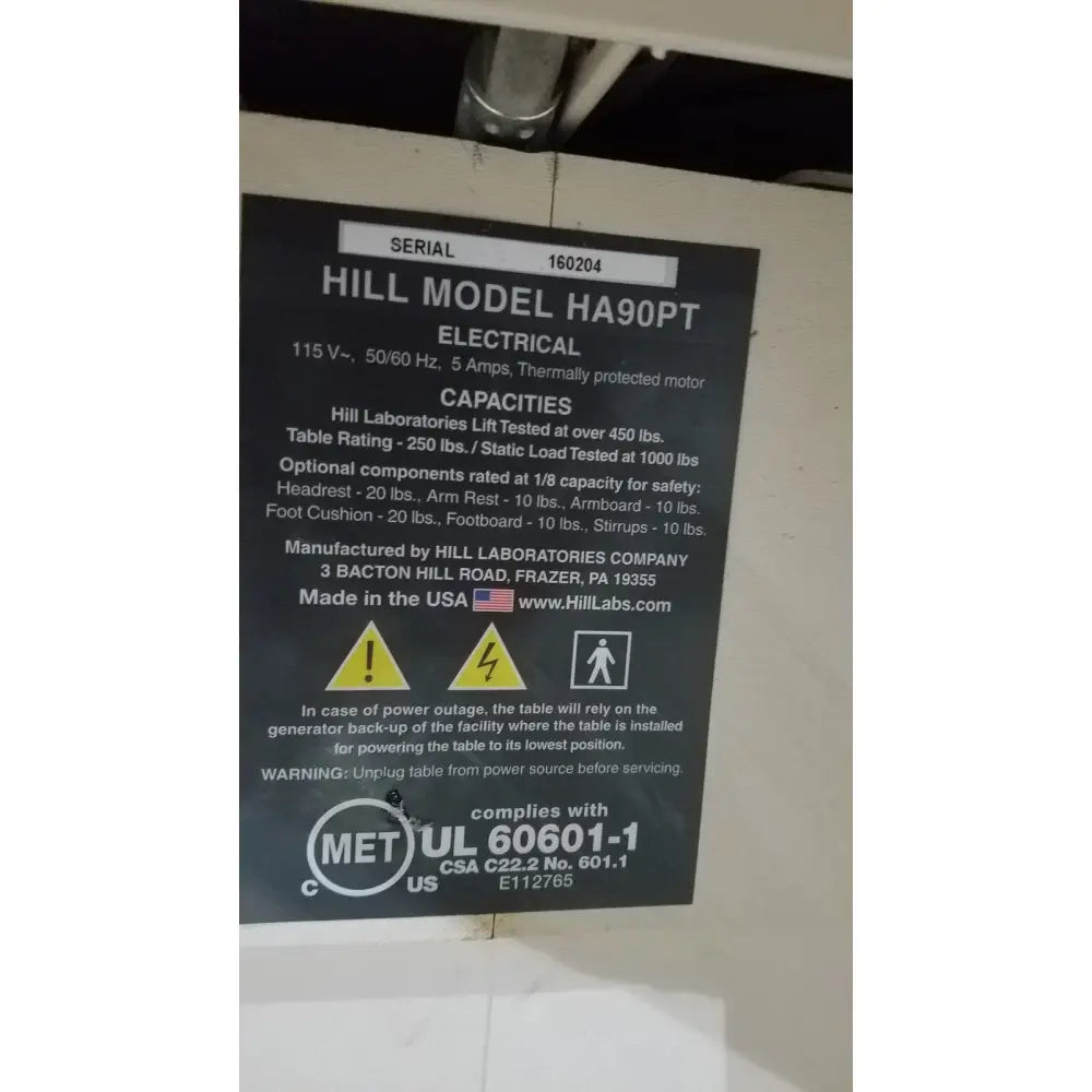 Black label with white text detailing specifications for hill model ha90pt physical therapy treatment table