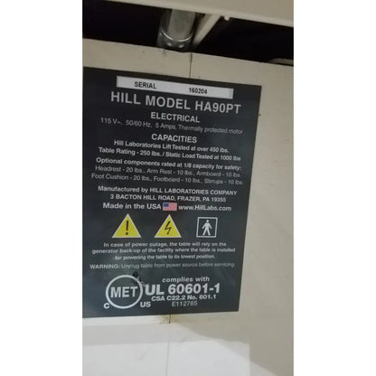 Black label with white text detailing specifications for hill model ha90pt physical therapy treatment table