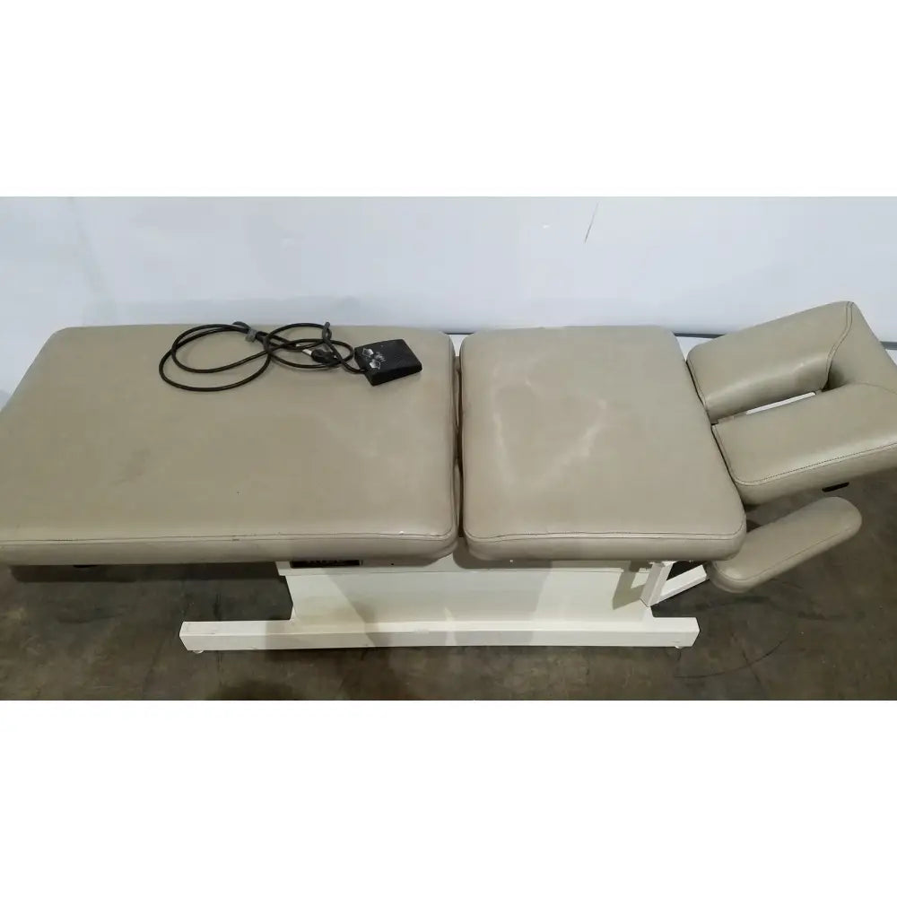 Beige leather adjustable chiropractor table with white metal frame hill model ha90pt physical therapy treatment table