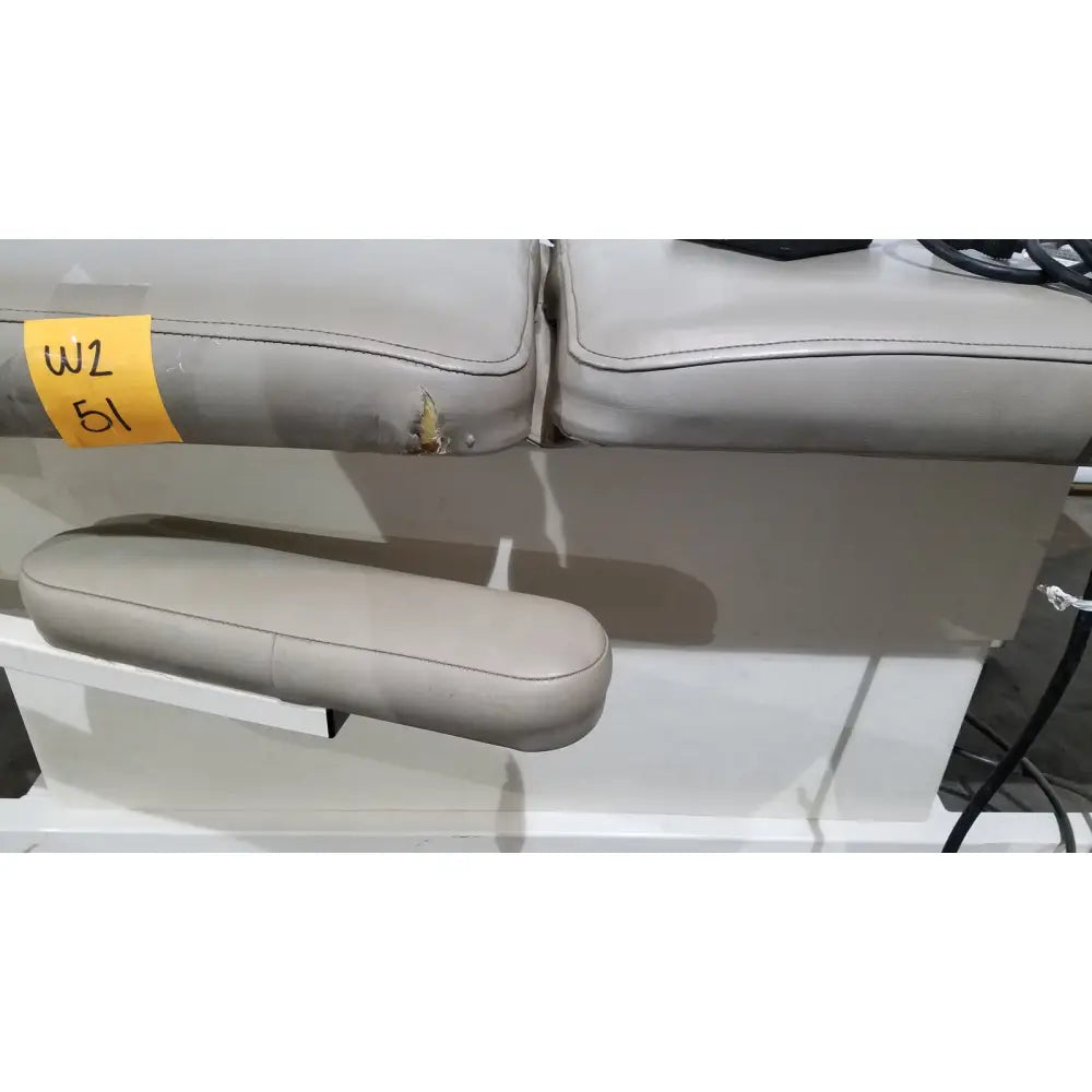 Beige leather armrest with visible stitching and small tear on hill model ha90pt physical therapy treatment table
