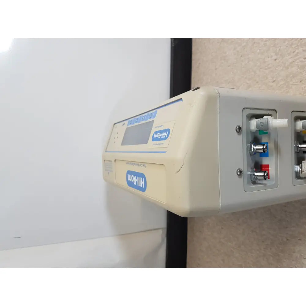 Beige hill rom excel care infusion pump with digital display and multiple colored ports for bariatric therapy system