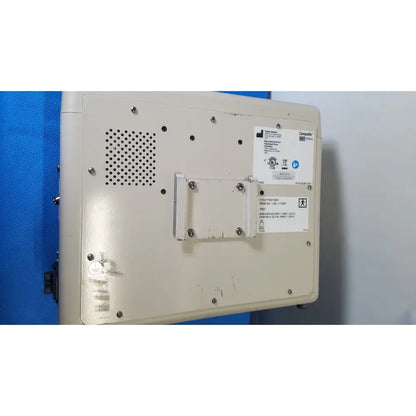 Beige plastic industrial control panel with ventilation grille and bracket on the back of hill-rom p7810 compella bariatric therapy system