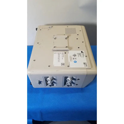 Beige medical imaging device with two circular ports and ge logo on the back of hill-rom p7810 compella bariatric therapy system