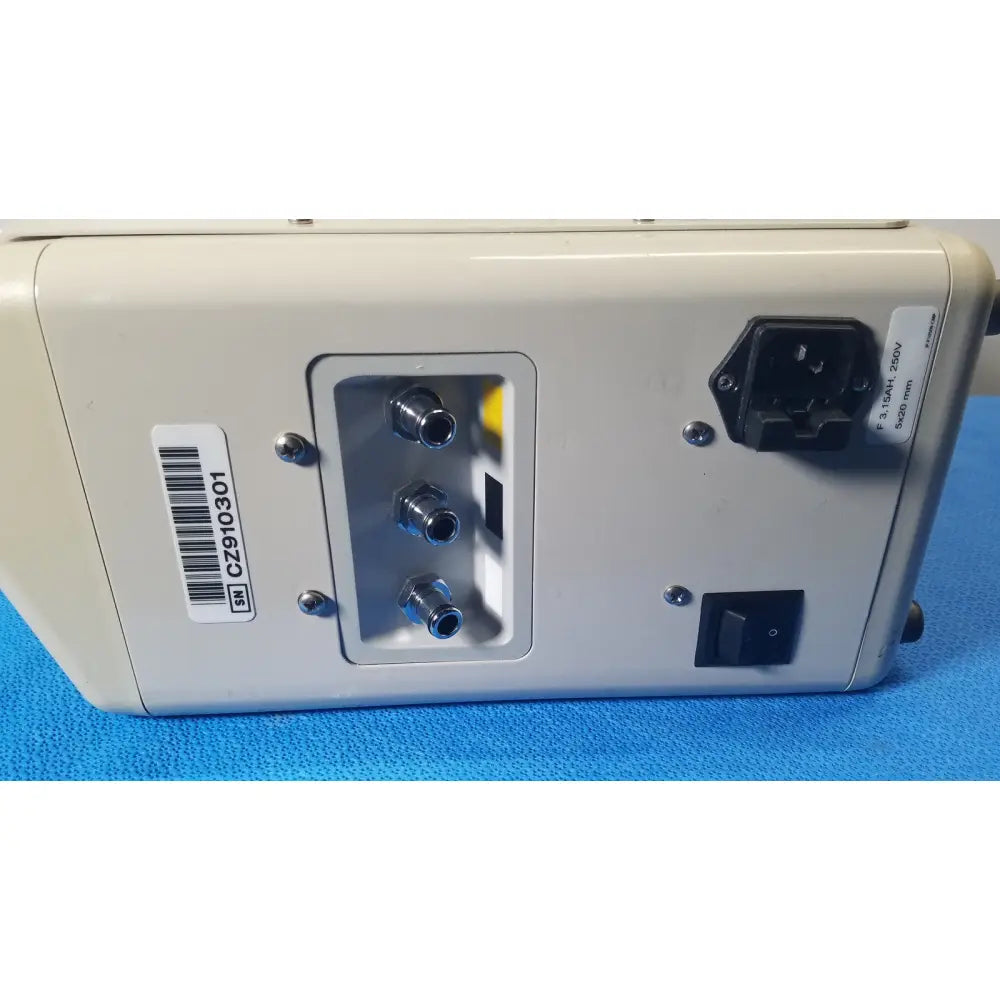 Beige back side of hill-rom p7810 compella bariatric therapy system with three metallic ports and power switch
