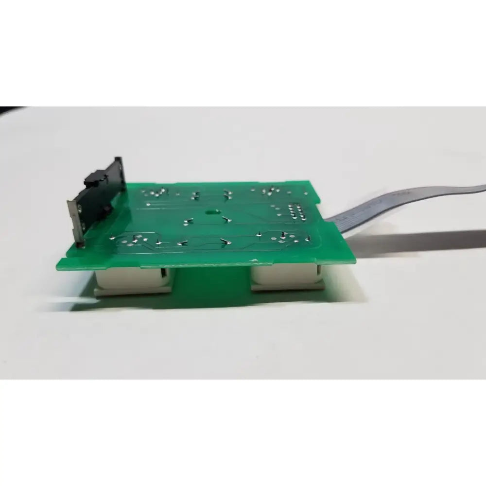 Green rectangular hill rom total care switch board with silver solder points black component and two white usb ports