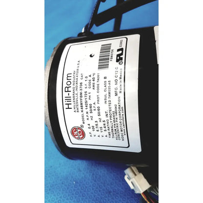 Black cylindrical hill-rom totalcare bed hydraulic power unit with white label displaying technical specifications
