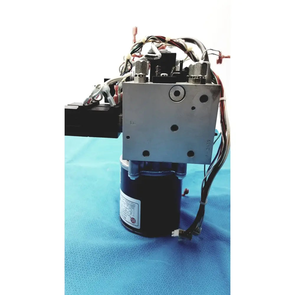 Silver metallic hill-rom totalcare bed hydraulic power unit assembly with black motor base and bundled wiring