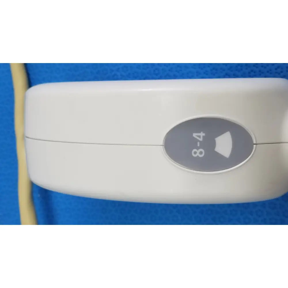 White plastic hitachi cc41r ultrasound probe handheld device with gray oval 8-4 mhz button and arrow symbol