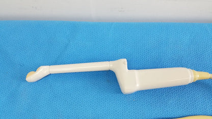 Cream-colored plastic hitachi cc41r ultrasound probe with curved handle and tapered tip for medical imaging use