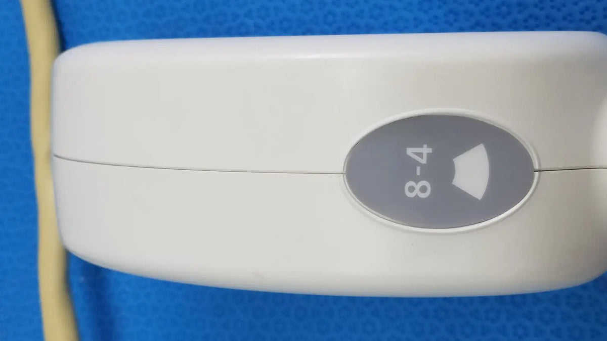 White plastic hitachi cc41r ultrasound probe handheld device with gray oval 8-4 mhz button and arrow symbol