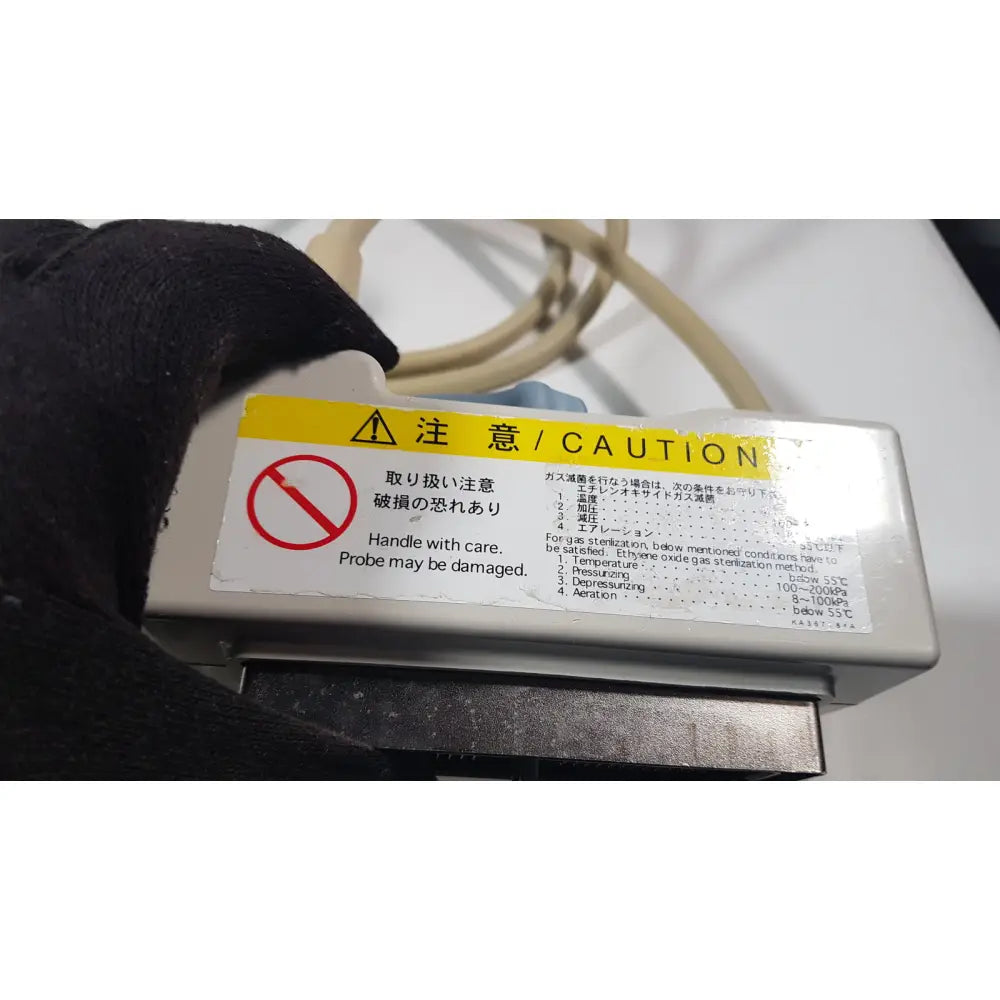 Gray plastic hitachi eup-cc531 ultrasound biplane transrectal probe sterilization device with yellow caution label and safety instructions