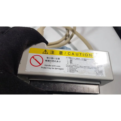 Gray plastic hitachi eup-cc531 ultrasound biplane transrectal probe sterilization device with yellow caution label and safety instructions