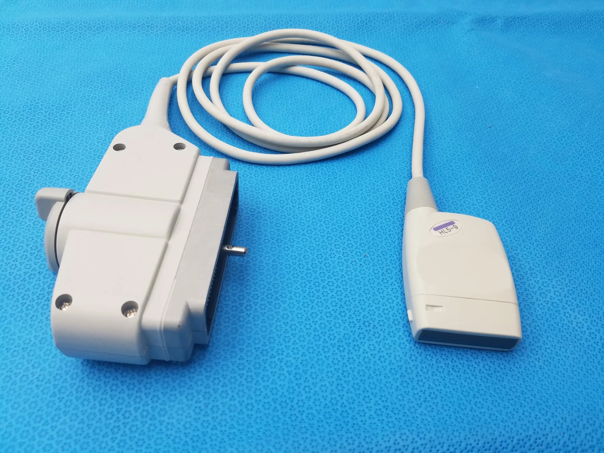 Hl5-9ed linear ultrasound transducer probe with white plastic housing and coiled cable for ultrasound imaging