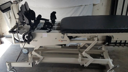 Beige hocoma ergo pro robotic tilt table with black padded surface and adjustable mechanical components for therapy