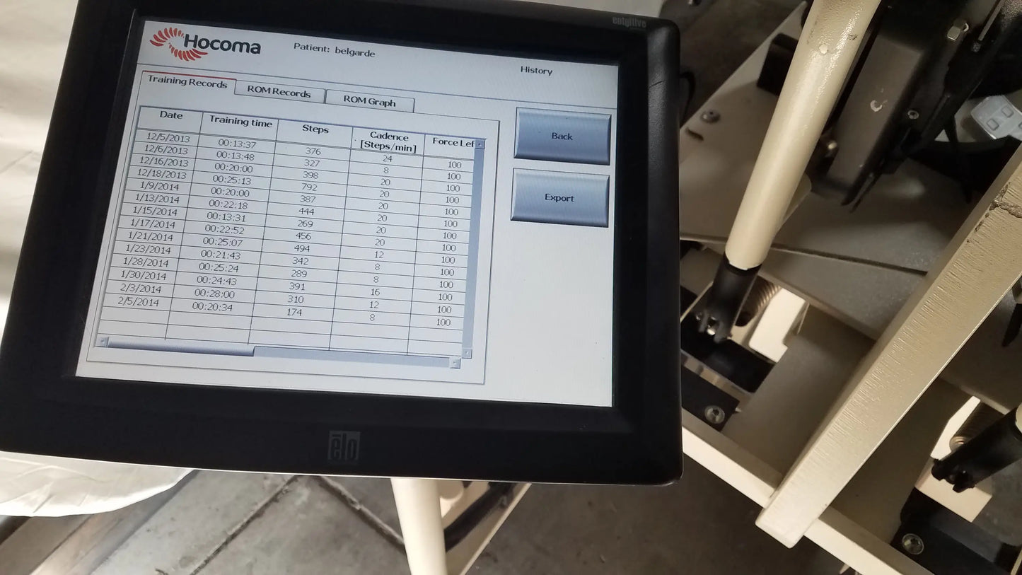 Black hocoma touchscreen display showing patient training records on erigo pro robotic tilt table verticalization therapy system