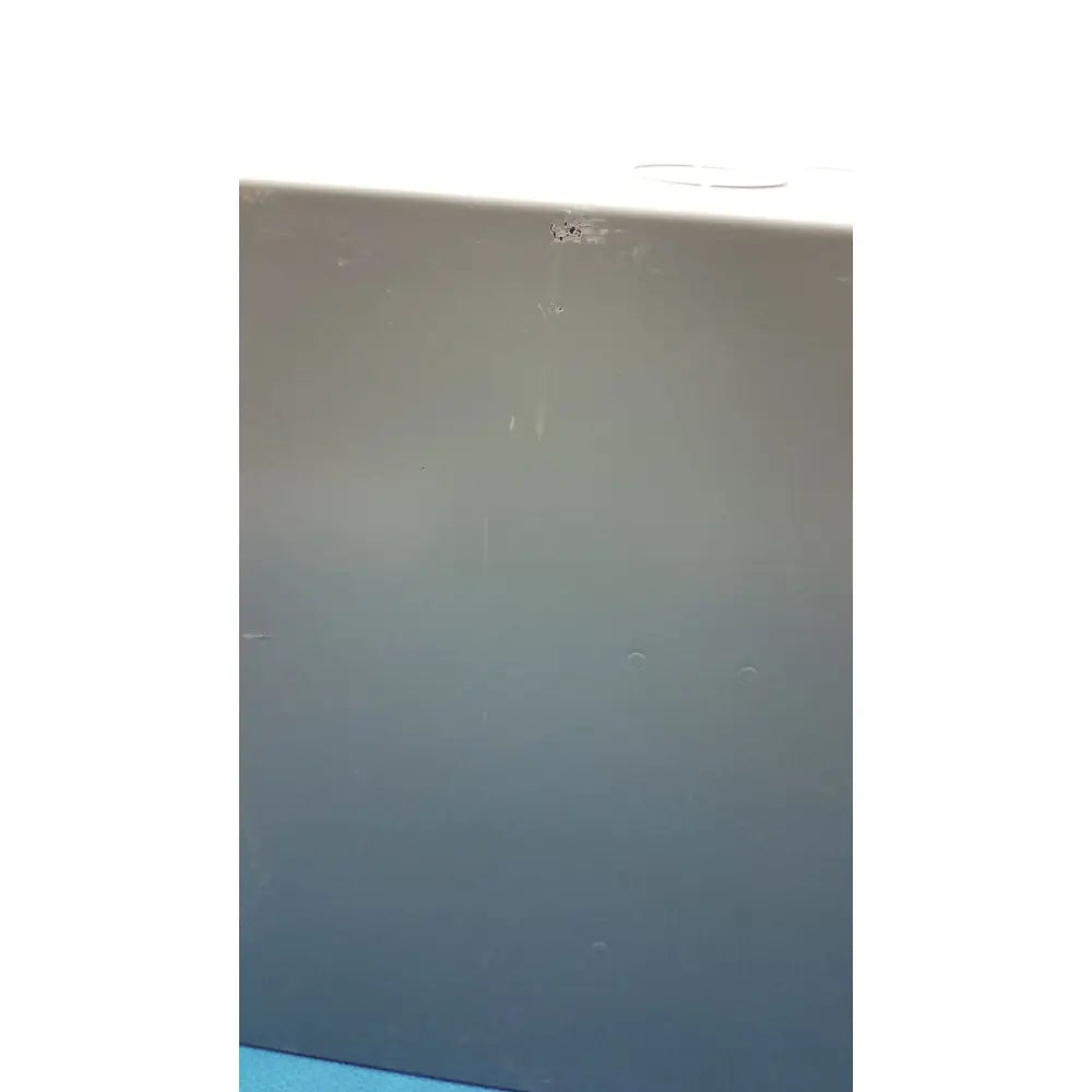 Gray plastic surface with minor scratches and dark speck on hoffman steel type 1 cutout box with latch