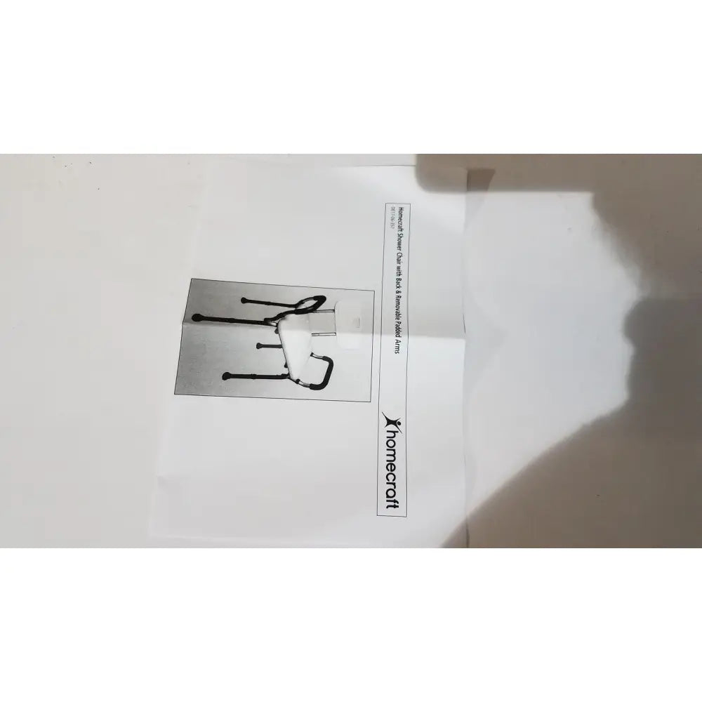 Black metal walker with curved handle and adjustable legs designed for use with homecraft shower chair padded removable arms