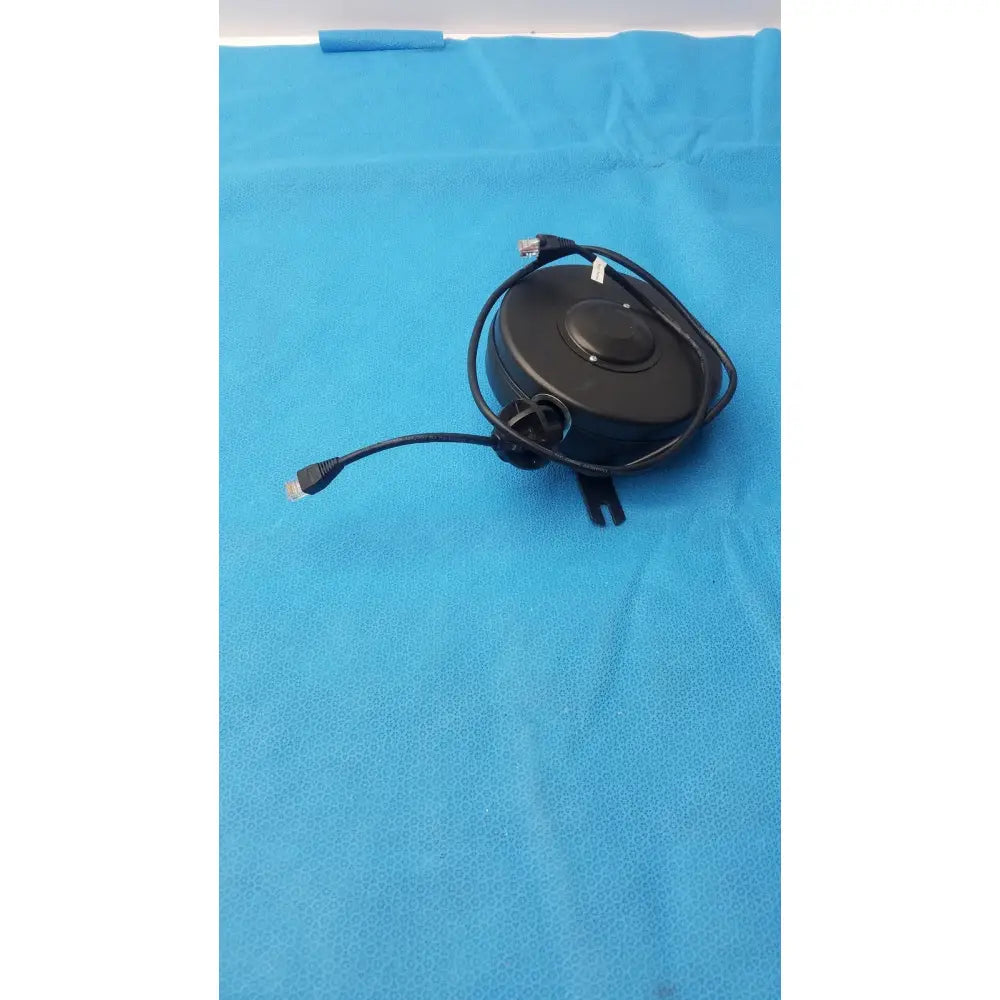 Hospital and network grade retractable cable reel in black with circular housing and two ethernet connectors for network use