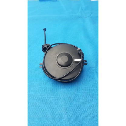 Black circular electric fan motor with coiled power cord and mounting brackets for hospital network grade retractable cable reel