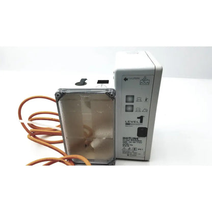 White plastic hotline HL-90 115v fluid warmer level 1 with transparent front panel and orange tubing for fluid warming