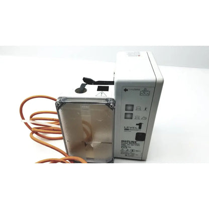 White plastic Hotline HL-90 115v fluid warmer level 1 with transparent front panel and orange tubing infusion pump
