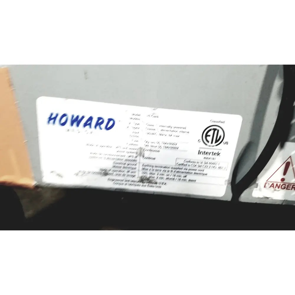 White rectangular label with blue howard text and certification marks on the back of howard medical hi-care monitor