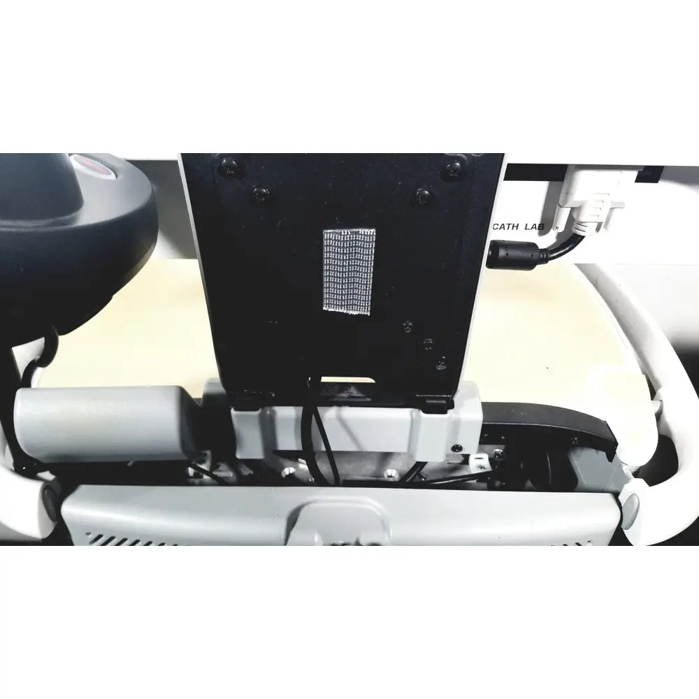 Black rectangular mesh vent panel with screws on the back of howard medical hi-care monitor and stand equipment