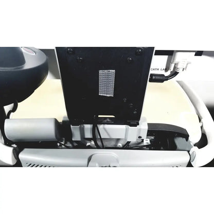 Black rectangular mesh vent panel with screws on the back of howard medical hi-care monitor and stand equipment