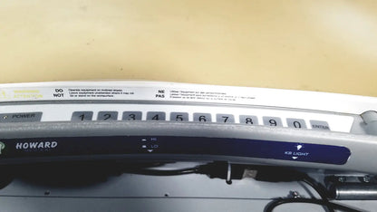Silver howard brand industrial control panel with numeric keypad and labeled buttons on howard medical hi-care monitor