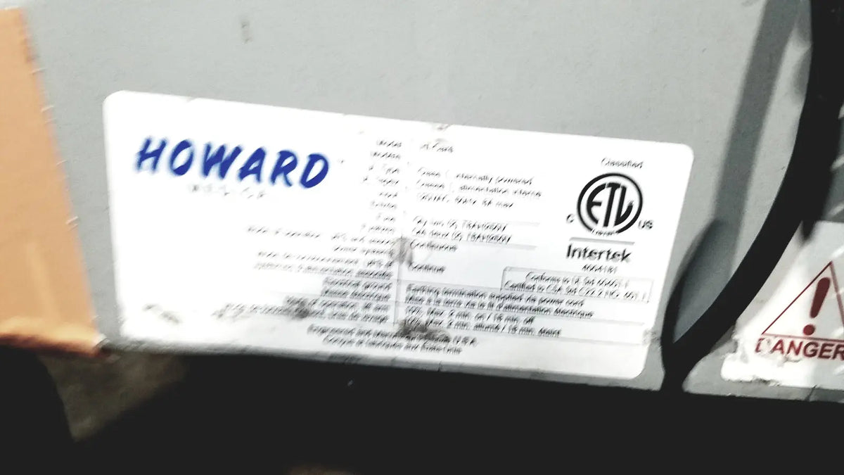 White rectangular label with blue howard text and certification marks on the back of howard medical hi-care monitor