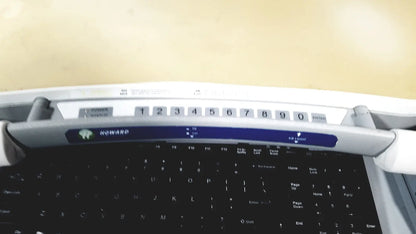 Howard Medical Hi-Care monitor and stand featuring a white and blue numeric keypad with black nowarp keys on laptop keyboard