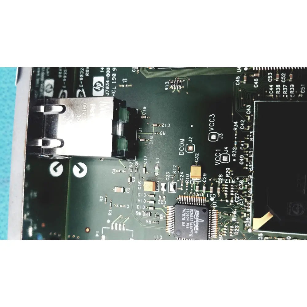 Black HP Jetdirect 620N motherboard with silver USB port and components for fast ethernet print server use
