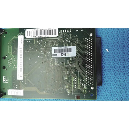 Green hp jetdirect 620n circuit board with white barcode labels and metallic solder points for fast ethernet print server