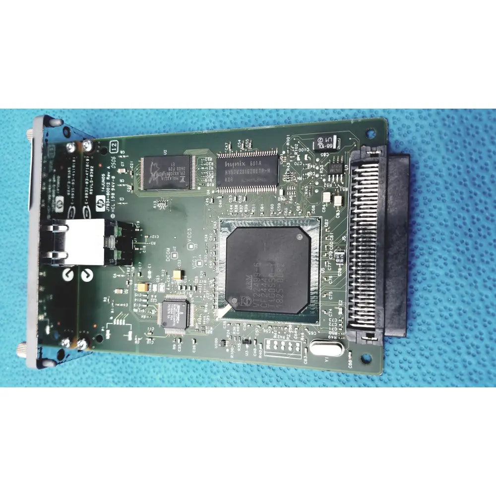 Green hp jetdirect 620n pci expansion card with black circuits and silver connectors for fast ethernet print server use