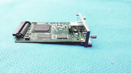 Green circuit board with black components and metallic bracket of hp jetdirect 620n fast ethernet print server