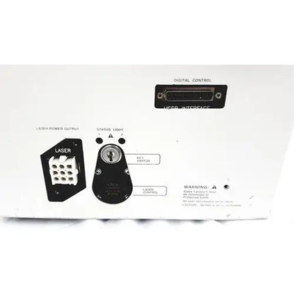 Black back side of hp power module laser power output connector with white grid pattern and labeled ports