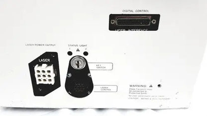 Black back side of hp power module laser power output connector with white grid pattern and labeled ports