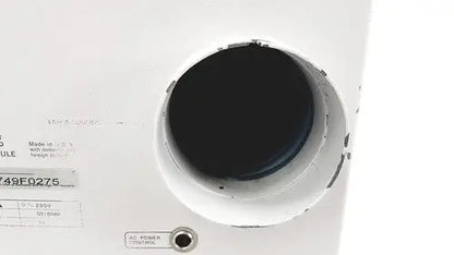 White circular speaker grille with black interior and manufacturer label on hp power module laser power output 50/60hz