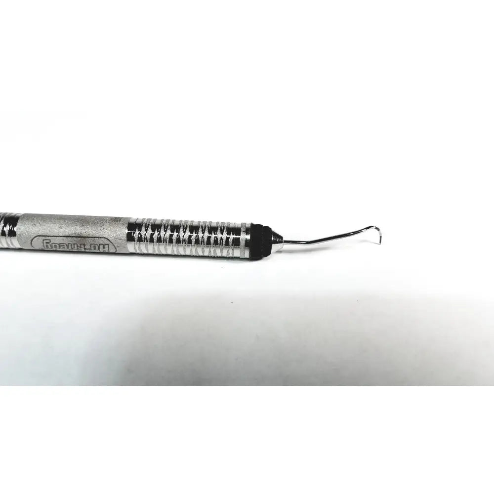Silver metallic hu-friedy odu pq2n7 dental instrument with textured grip and curved metal tip for periodontal use
