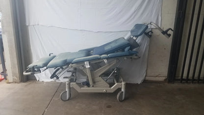Adjustable bariatric convertible chair with blue segmented padding and metallic frame humanCare i-400 model