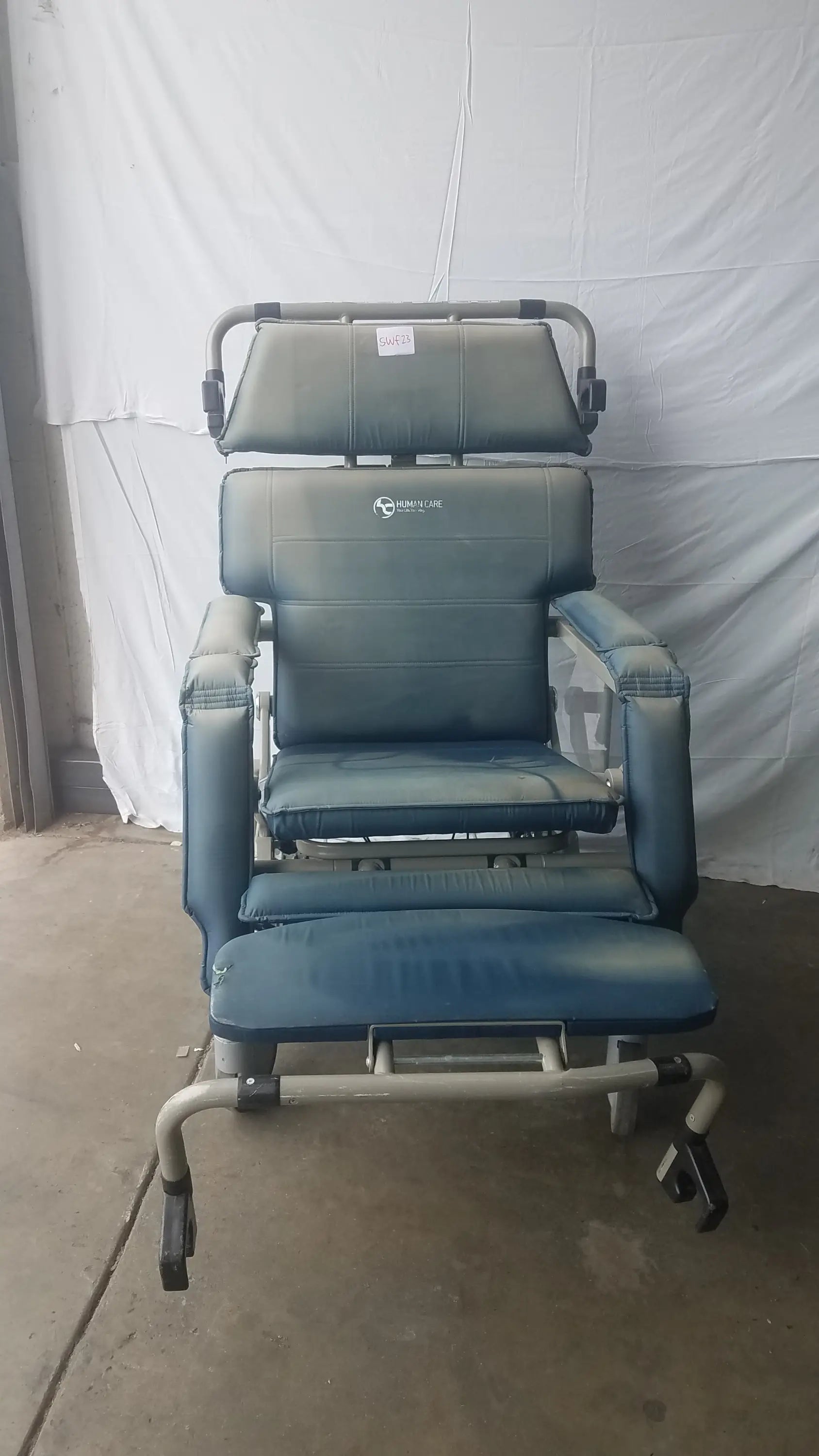 HumanCare I-400 bariatric convertible chair in blue upholstery with padded headrest footrest metal frame and caster wheels